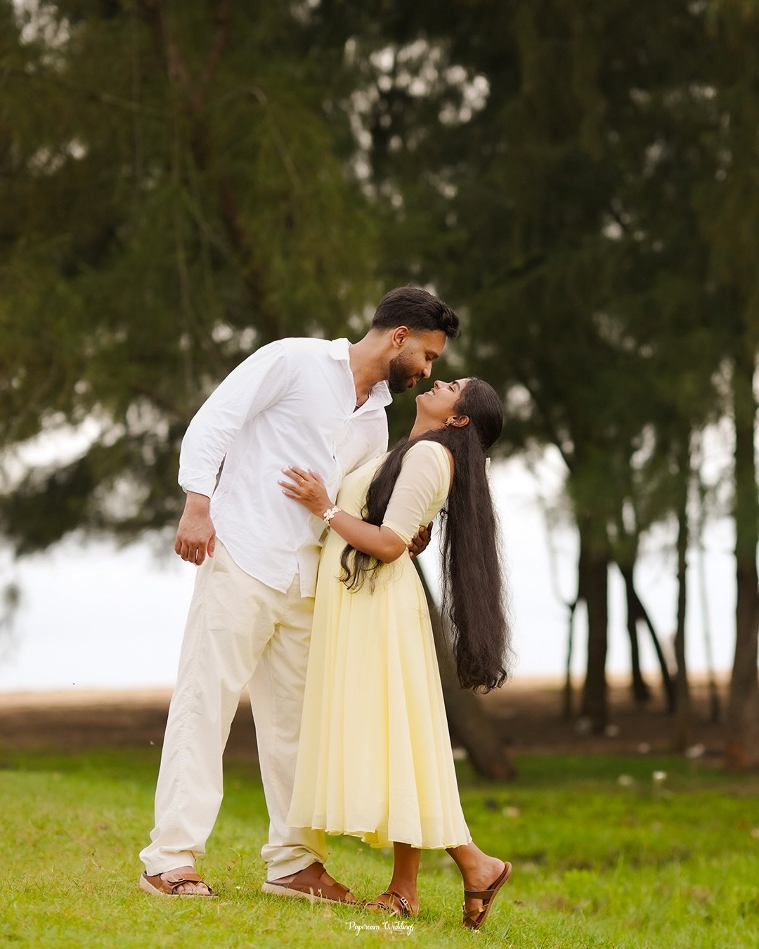 A couple laughing together during an outdoor portrait session